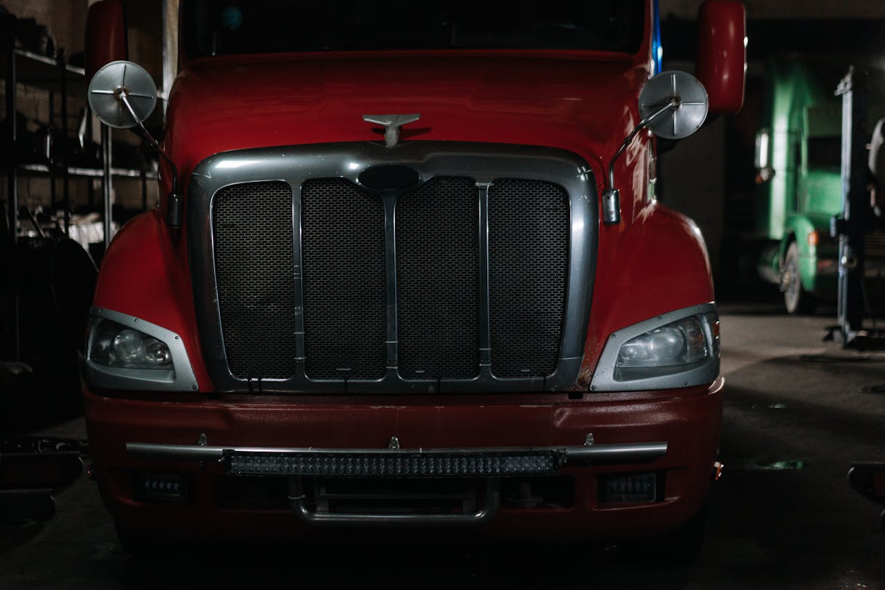 Photo by cottonbro studio: https://www.pexels.com/photo/red-and-silver-vintage-carrier-truck-7006131/