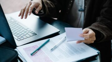 Photo by George Pak : https://www.pexels.com/photo/close-up-shot-of-a-person-holding-a-papers-7972282/