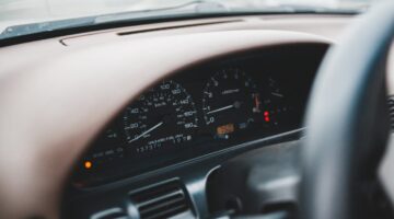 Photo by Erik Mclean: https://www.pexels.com/photo/speedometer-and-part-of-steering-wheel-4991556/