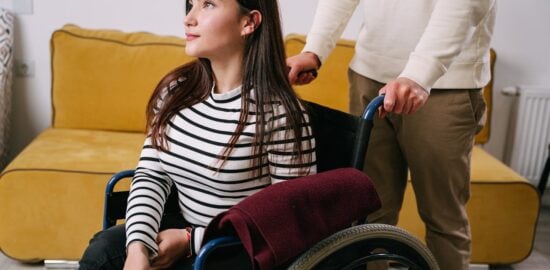 Photo by Ivan Samkov: https://www.pexels.com/photo/a-person-pushing-a-woman-in-a-wheelchair-8127504/