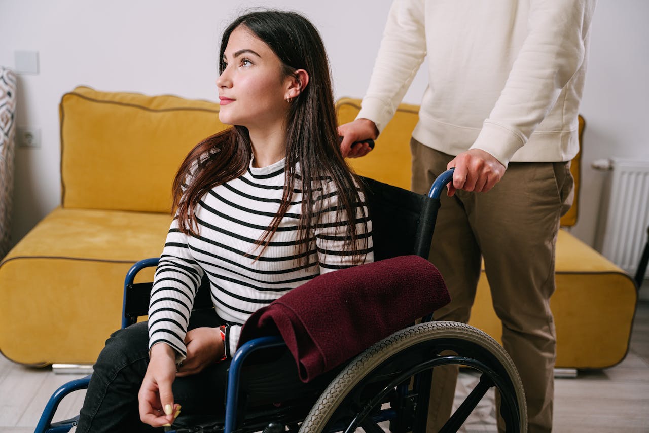Photo by Ivan Samkov: https://www.pexels.com/photo/a-person-pushing-a-woman-in-a-wheelchair-8127504/