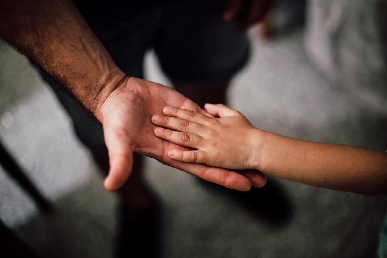 Photo by Juan Pablo Serrano : https://www.pexels.com/photo/father-and-child-s-hands-together-1250452/