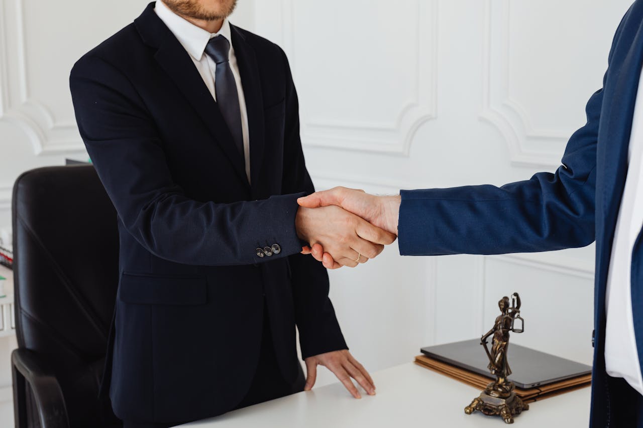 Photo by Photo By: Kaboompics.com: https://www.pexels.com/photo/hand-shake-of-two-men-7875996/