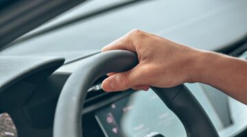 Photo by Leon Kohle: https://www.pexels.com/photo/a-close-up-shot-of-a-person-driving-a-car-13165489/