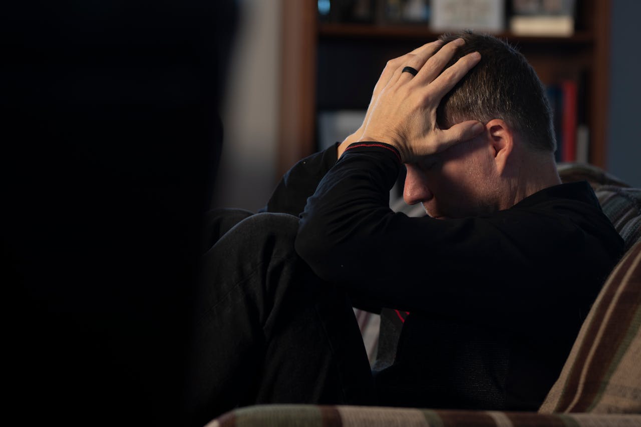 Photo by Malachi Cowie: https://www.pexels.com/photo/man-sitting-with-hands-on-head-10574670/