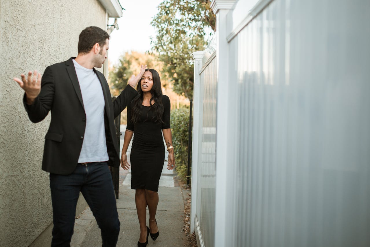 Photo by RDNE Stock project: https://www.pexels.com/photo/man-in-black-suit-standing-beside-woman-in-black-dress-5616189/
