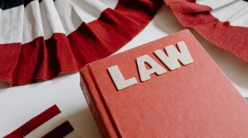 Photo by Tara Winstead: https://www.pexels.com/photo/close-up-shot-of-a-law-book-8850742/