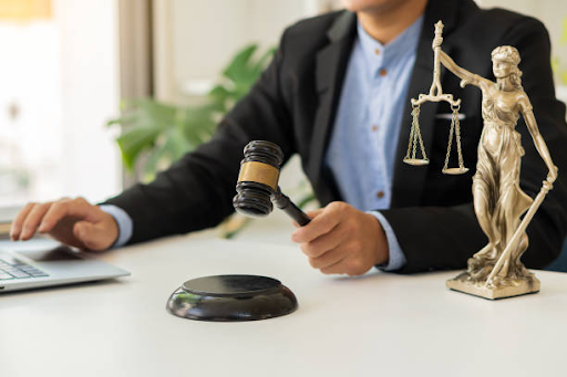 https://www.istockphoto.com/photo/the-goddess-of-justice-with-scales-and-hammers-placed-in-front-of-a-male-lawyer-gm1353716765-428736343
