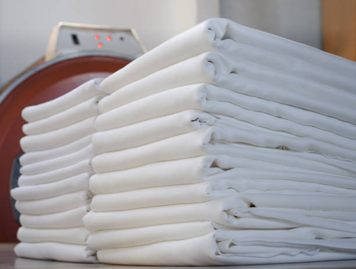 https://www.istockphoto.com/photo/stacks-of-folded-white-fabrics-in-a-laundry-cleaning-service-for-institutions-and-gm1178630918-329513776