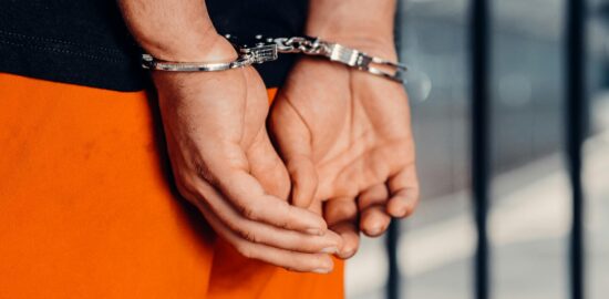 Photo by Kindel Media: https://www.pexels.com/photo/a-person-in-handcuffs-7785046/