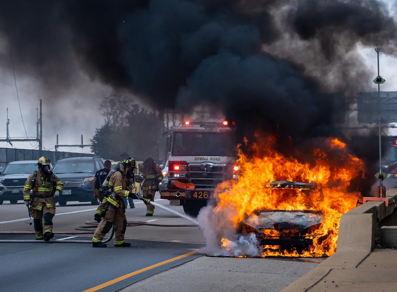 Photo by Styves Exantus: https://www.pexels.com/photo/firefighters-putting-down-flaming-car-14299428/